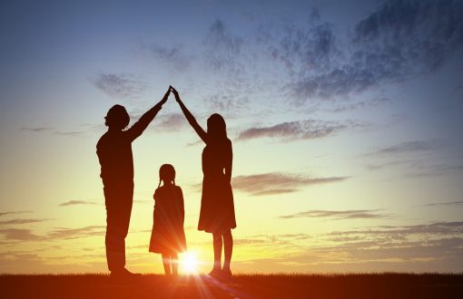 A family gathered around a table with a legal advisor, discussing inheritance law, with a document and gavel in view, highlighting the importance of legal guidance in estate planning.